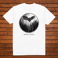 Jersey Devil engraved cryptid t-shirt — black and white crosshatch medallion design on white tee, flat lay