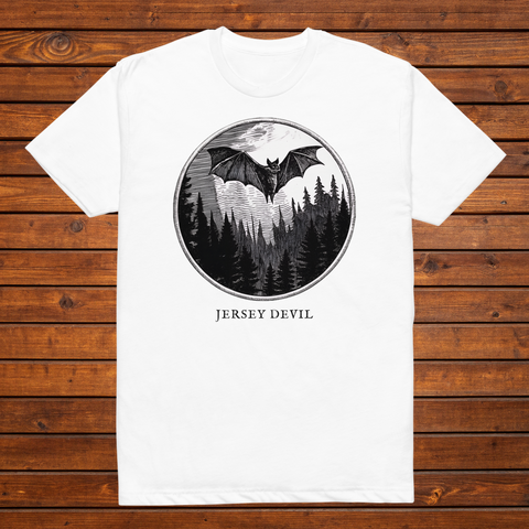 Jersey Devil engraved cryptid t-shirt — black and white crosshatch medallion design on white tee, flat lay