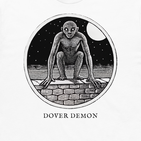 Dover Demon engraved cryptid t-shirt — crosshatch medallion design close-up
