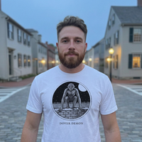 Model wearing the Dover Demon engraved cryptid t-shirt outdoors